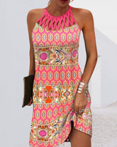 Ärmlös klänning med halternecktryck